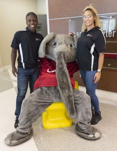 Handshake hand chair with Big Al and Career Center student staff